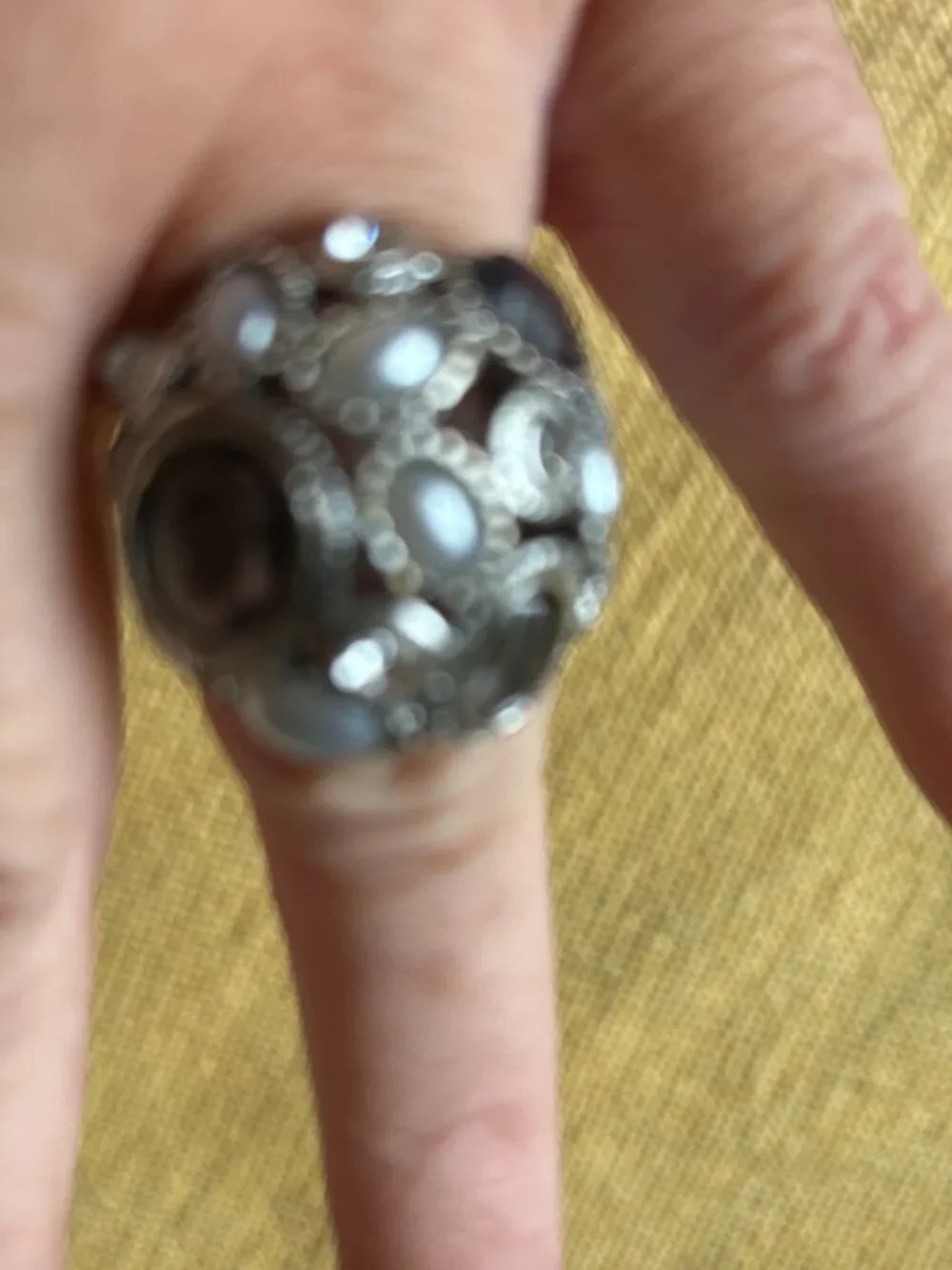 Vintage style sliver-tone dome cocktail ring featuring an intricate cluster of